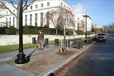 Street view of federal building in daylight with man on sidewalk