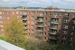 Exterior view of large apartment complex.